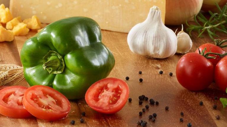 Colorful foods on wooden surface