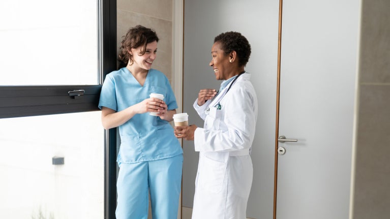 Doctor and nurse drinking coffee
