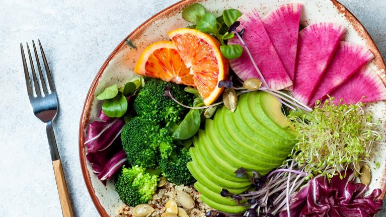 Vegan plate with vegetables and fruit