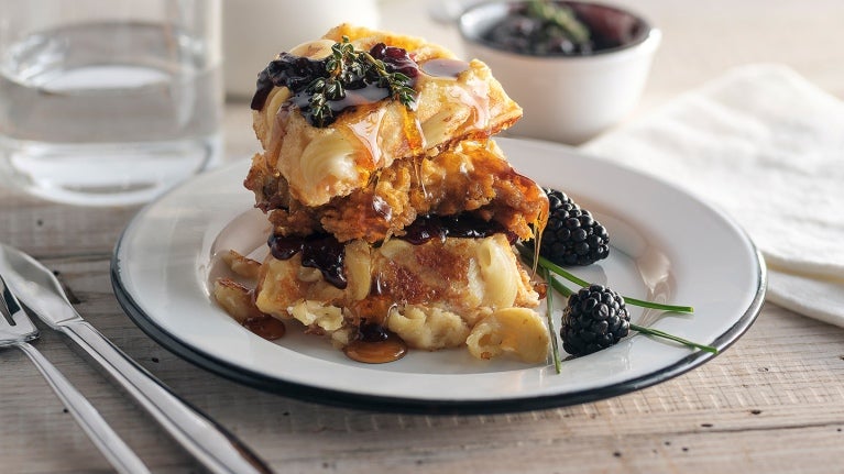 Stack of waffles and chicken with blackberries