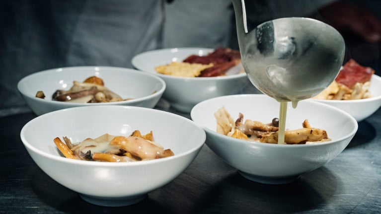 Sauce being poured from a ladle