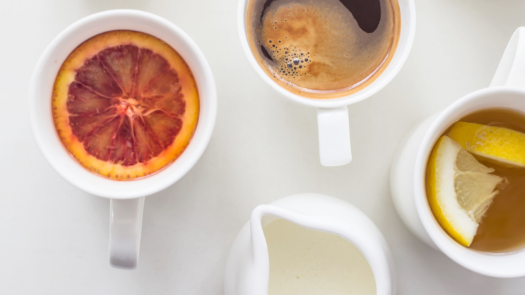 Three Drinks in White Cups along with creamer