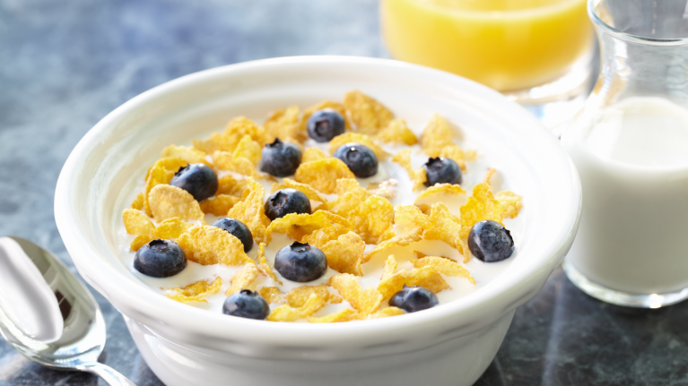 cereal in bowl with milk and juice