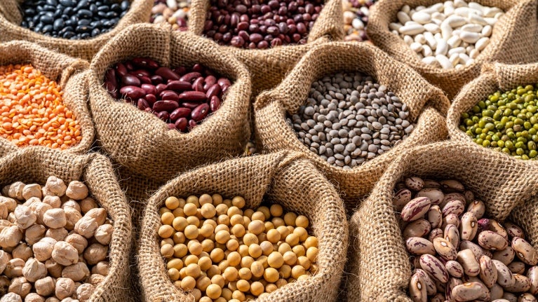 various beans in burlap sacks