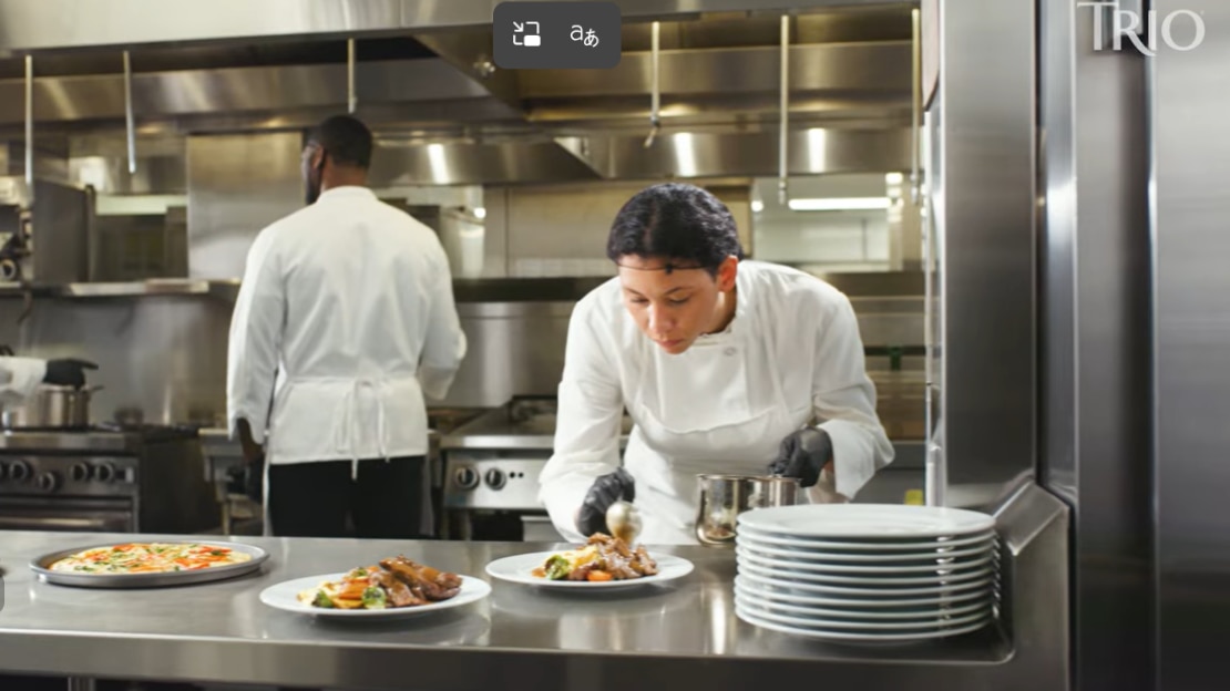 two chefs working in kitchen