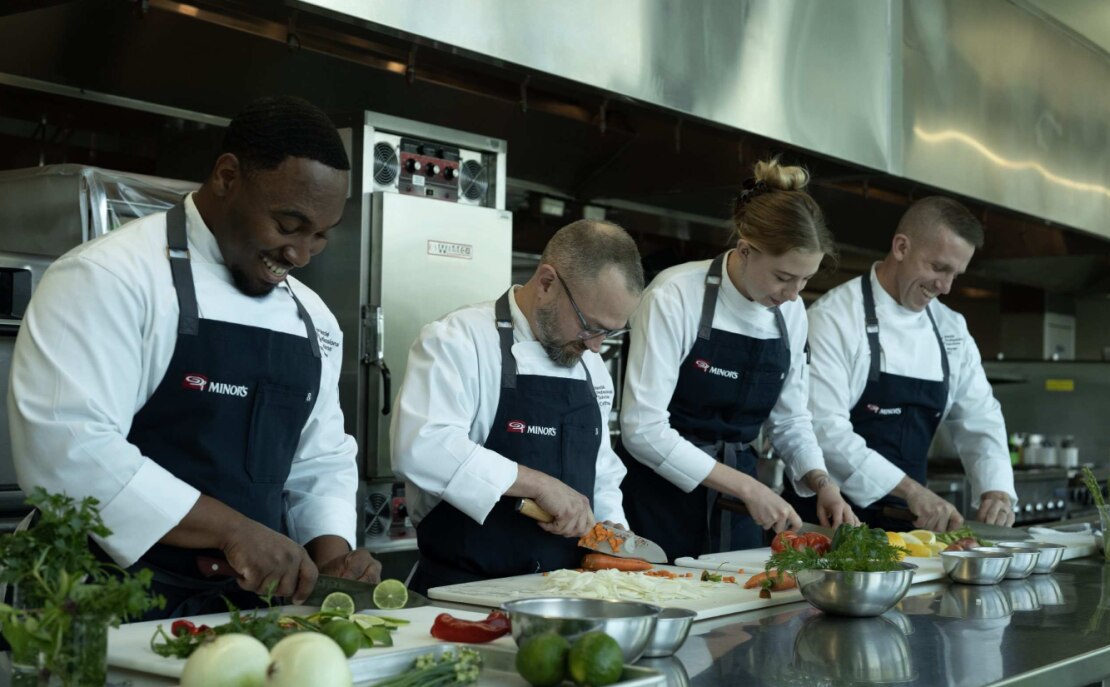 team of chefs cooking on the line