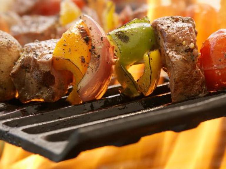 Vegetable-centric kebabs on an outdoor grill