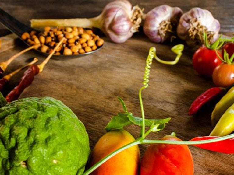 Flavorful condiments and spices on wooden platter