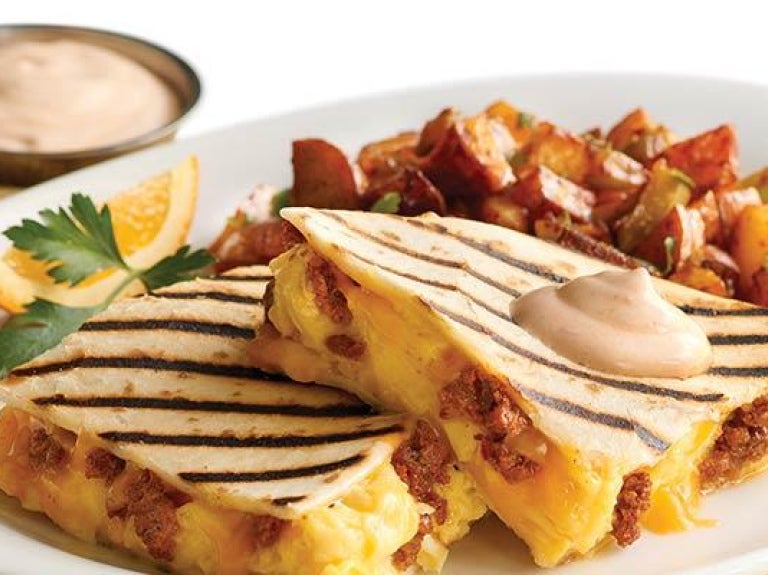 Plate of breakfast quesadillas with bacon