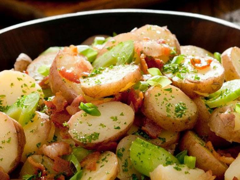 Wooden bowl with side of potato salad