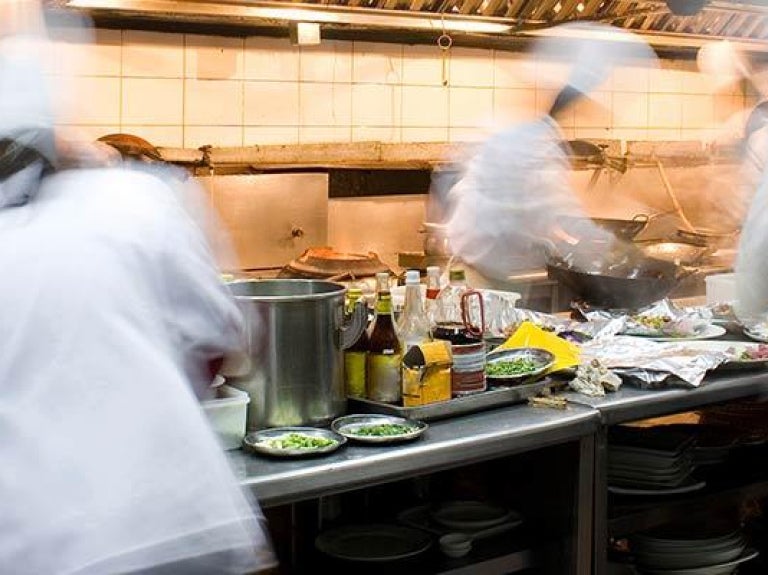 Cooks working in a busy kitchen