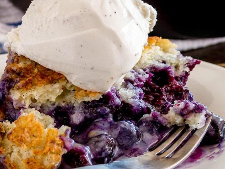 Plate of blueberry cobbler with ice cream