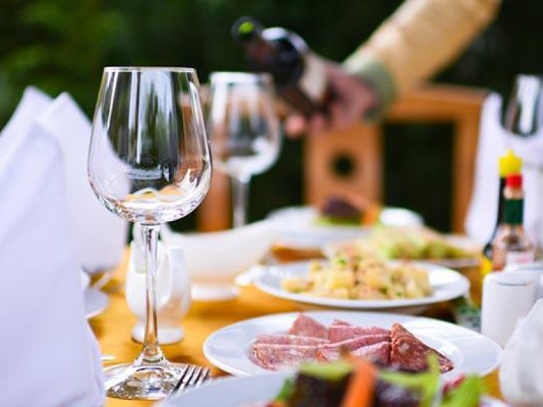 Outdoor banquet with hors d'oeuvres and wine service