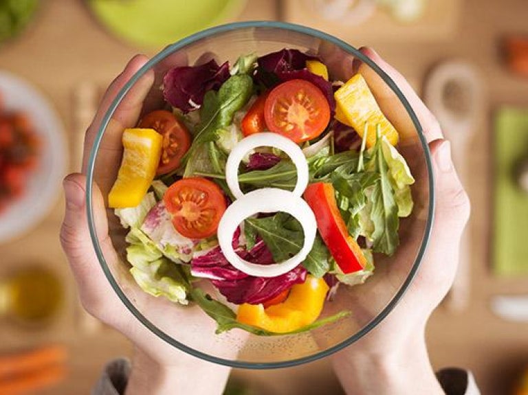 Fresh and colorful salad in glass bowl