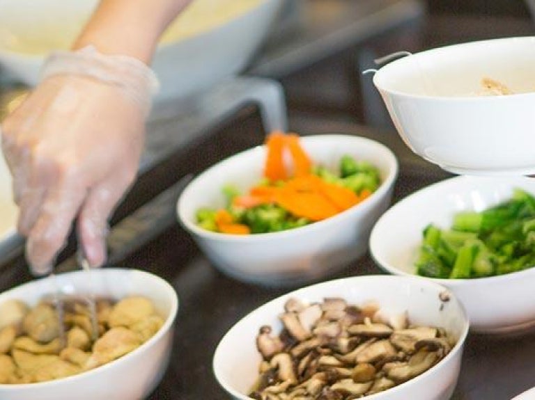 Person making selections at a food bar