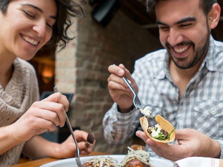Two people sharing a meal at a restaurant