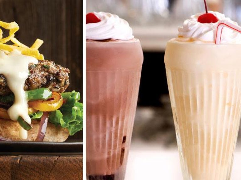 Signature cheeseburger; three shakes in glasses