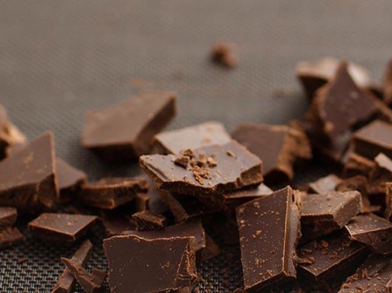 Crumbled chocolate pieces on a textured surface