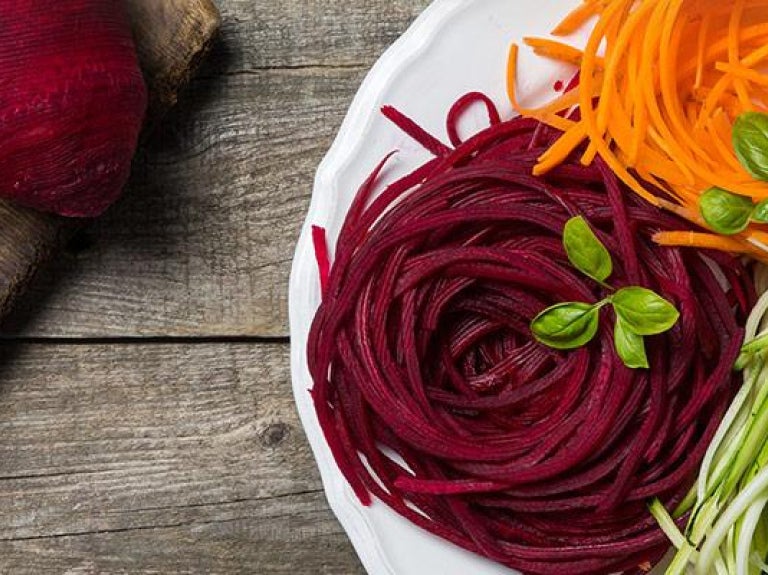 Plate of spiralized vegetables made from carrot, zucchini, and beetroot