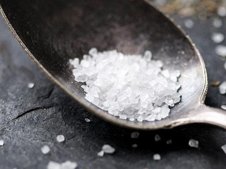 Measure of rock salt in spoon