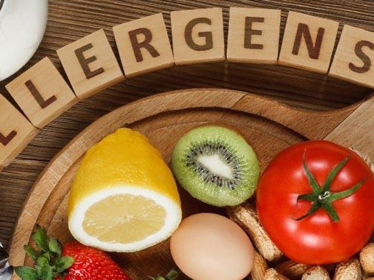 Assorted food allergens on wooden table