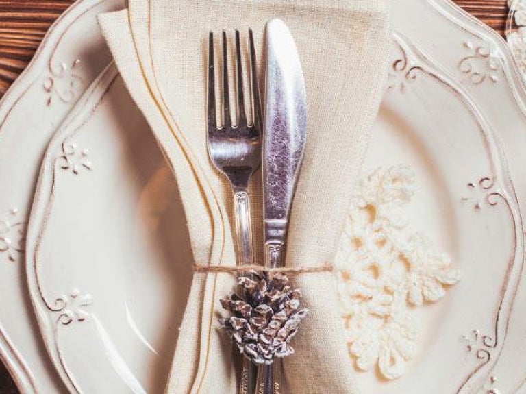 Holiday plate setting on wooden tabletop