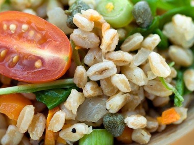 Wooden spoon with farro salad
