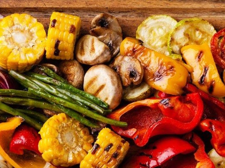 Wooden platter of grilled vegetables