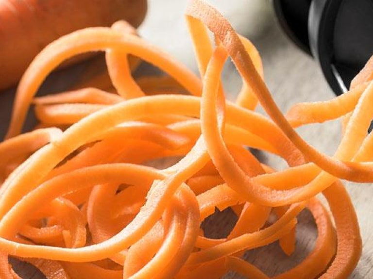 Fresh carrot sliced into spaghetti strands