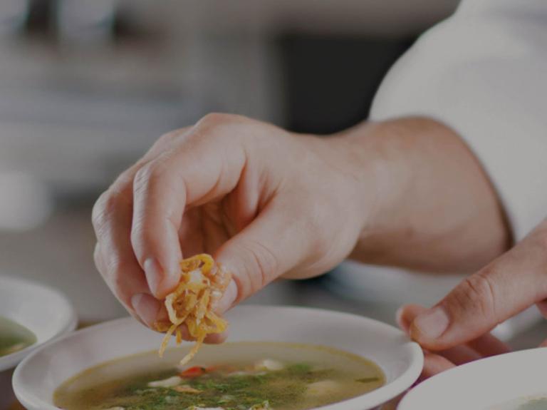 chef garnishing a plate