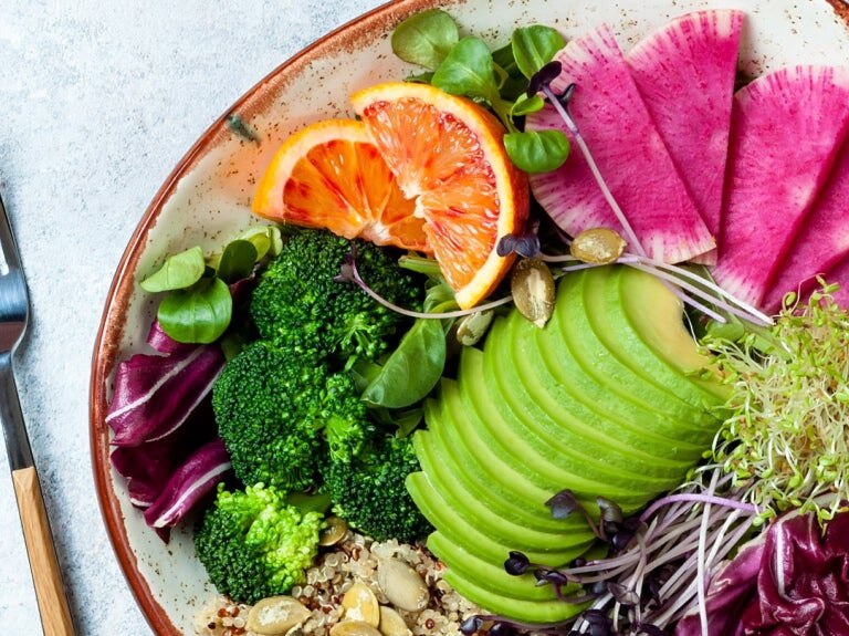 Vegan plate with vegetables and fruit
