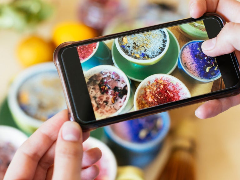 Cell Phone taking picture of food
