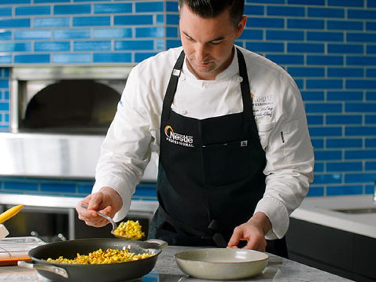 Chef Logan plating food