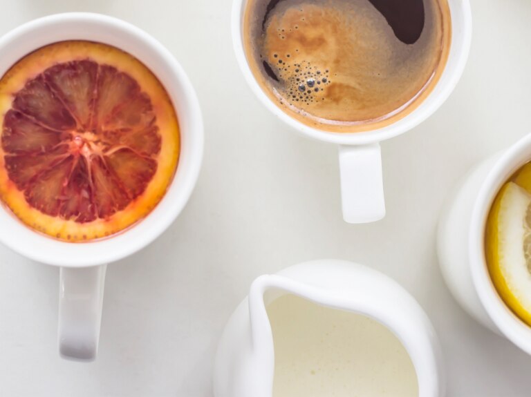 Three Drinks in White Cups along with creamer