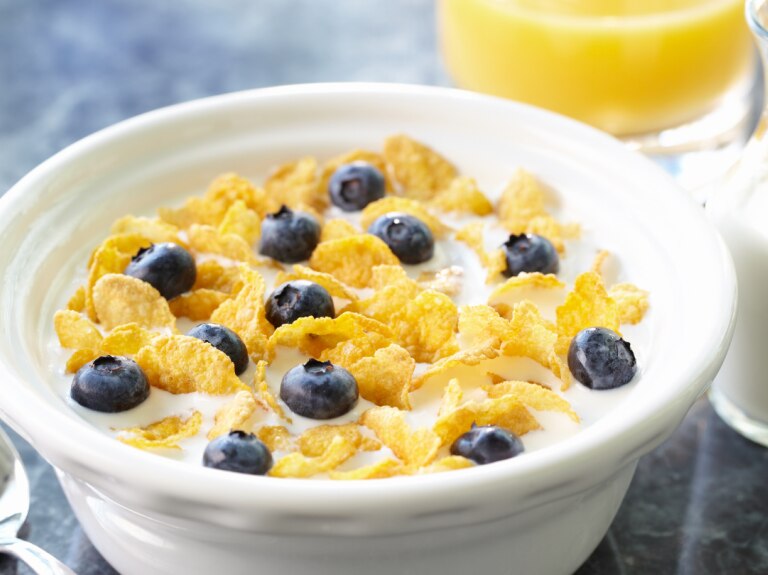 cereal in bowl with milk and juice