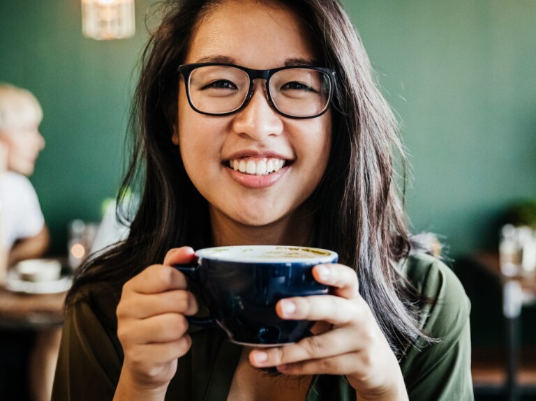 Woman drinking coffee in cafe