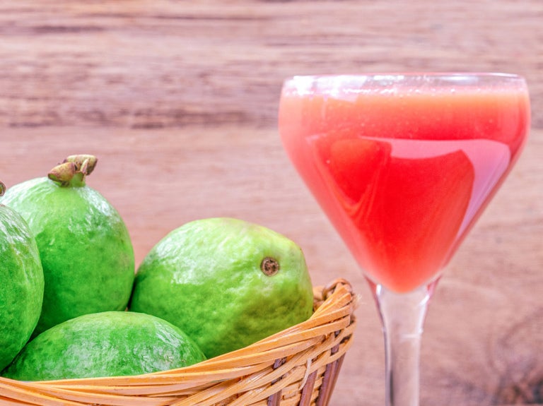 basket of pears with drink in log stemmed glass