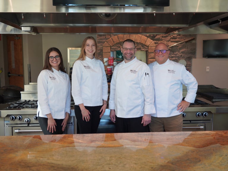 group image of chefs in kitchen
