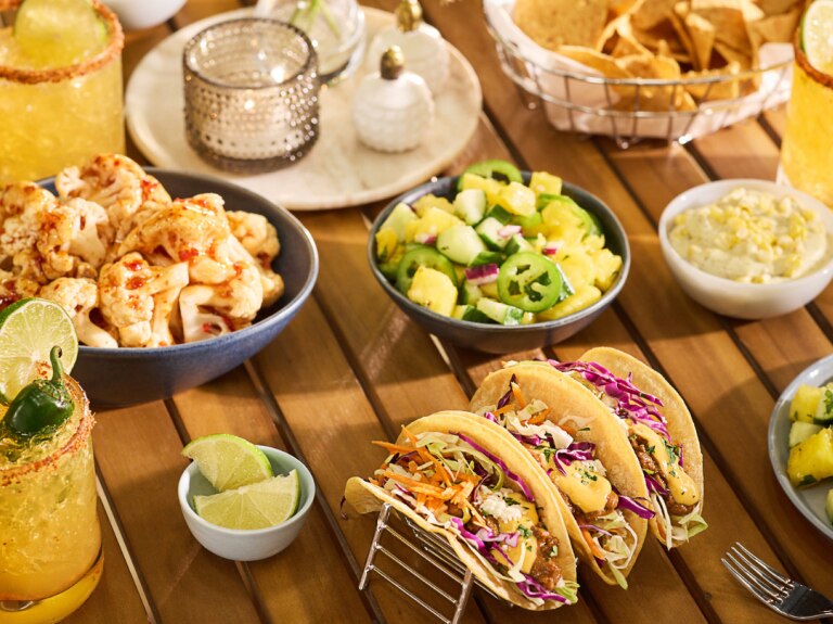 July trend report tacos, drinks and limes on table