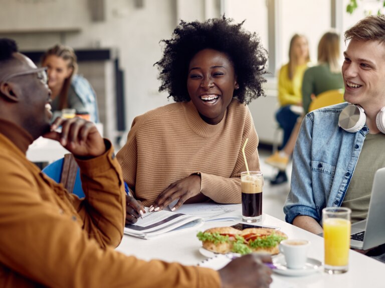 three friends dining out laughing