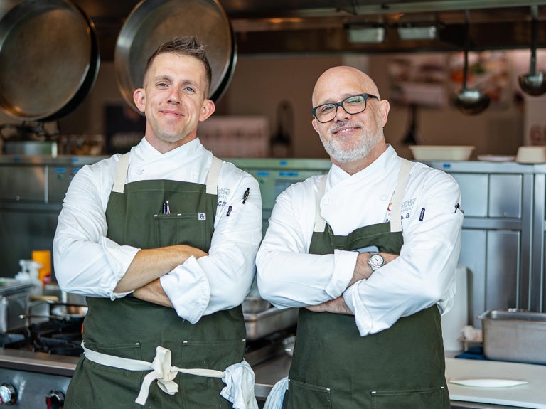 Two chefs in aprons