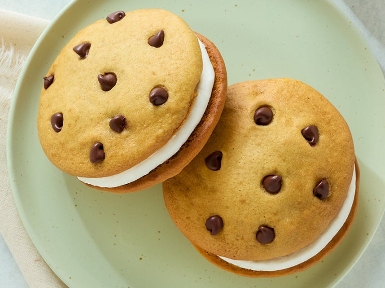Two semi-sweet morsels cookie sandwiches with whipped cream filling