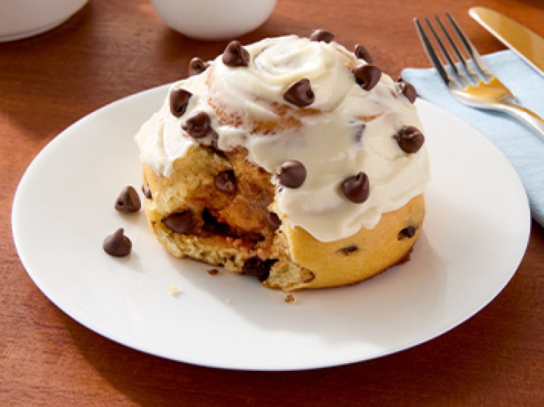cinnamon roll on plate using Nestle Toll House morsels and Carnation