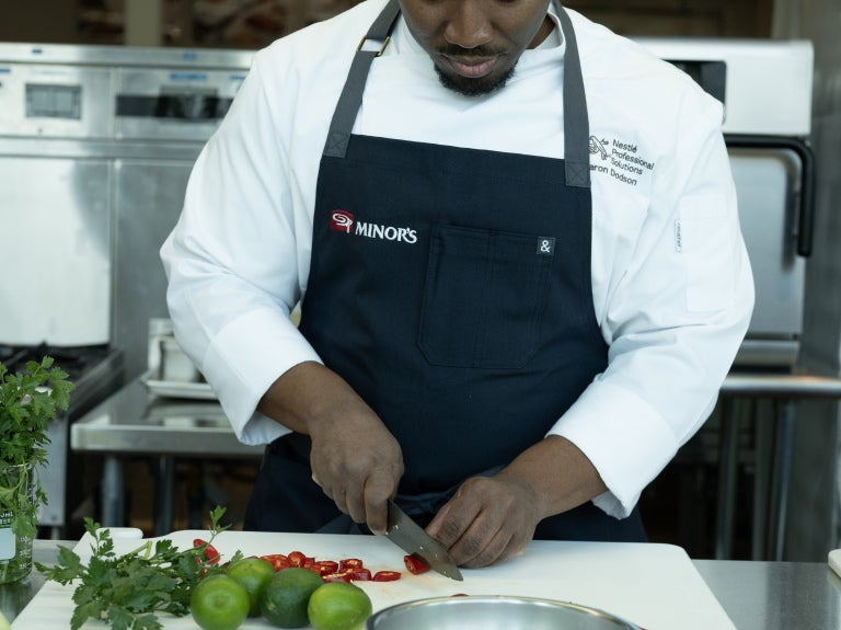 chef cutting fruits and vegetables