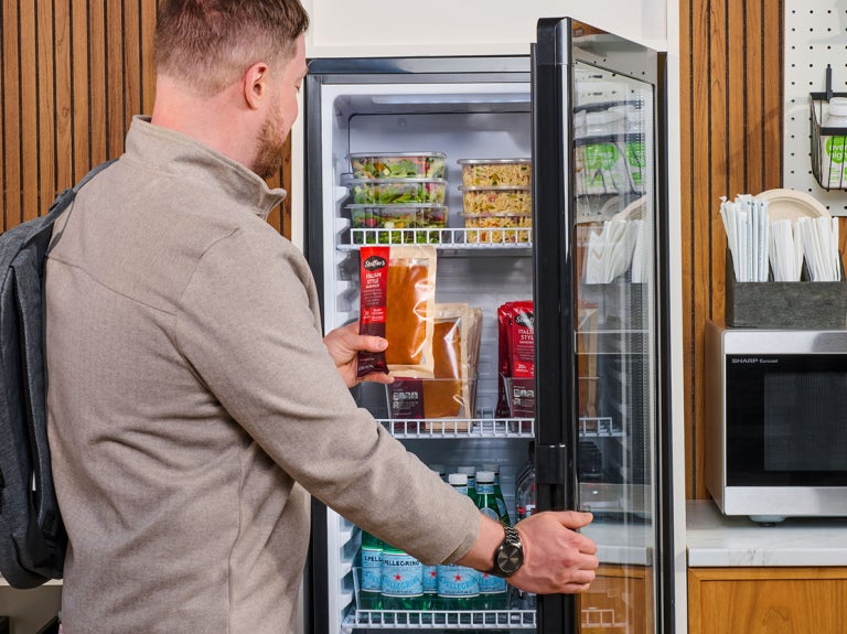 man taking stouffers sandwich to go