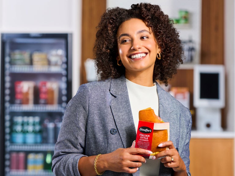 Woman holding Stouffers Italian style sandwich