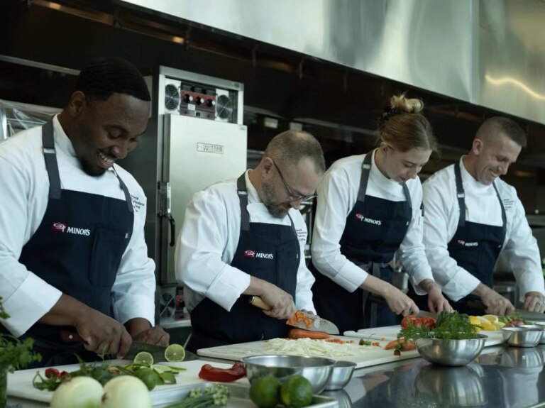 team of chefs cooking on the line