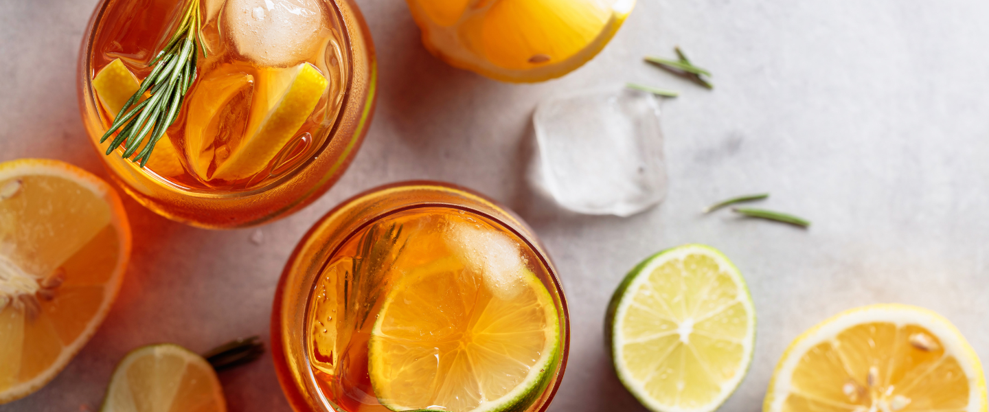 Orange and limes in and around beverages