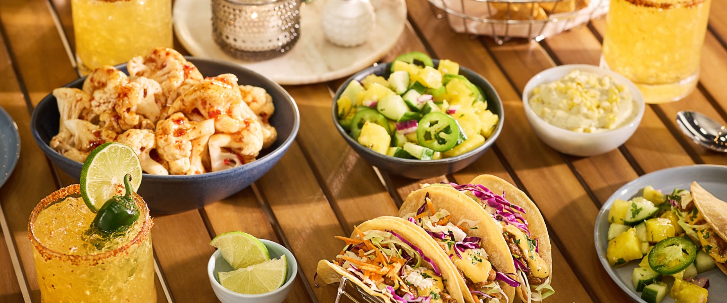 July trend report tacos, drinks and limes on table