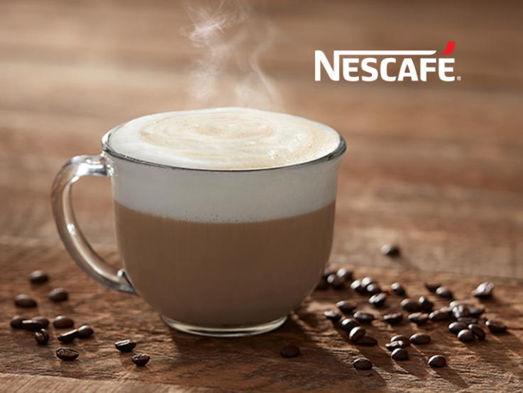 Cup of hot coffee with foam